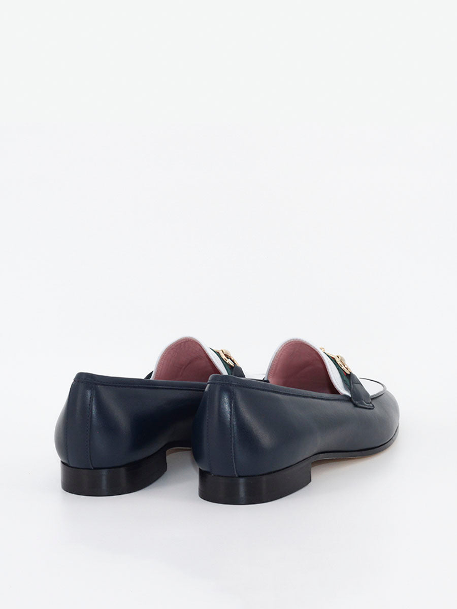 Taormina navy leather loafers with white topknot 