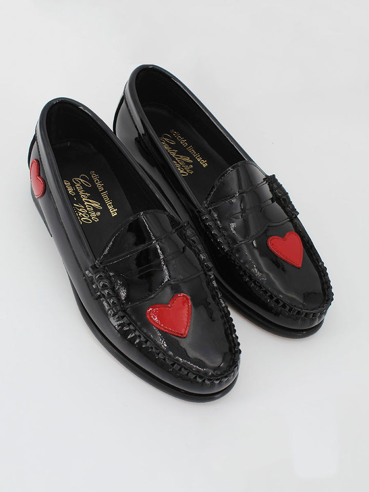 Black patent leather loafers with hearts decoration
