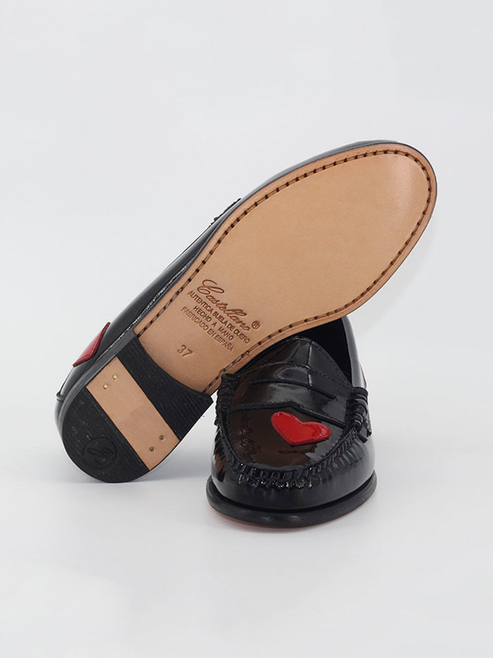 Black patent leather loafers with hearts decoration